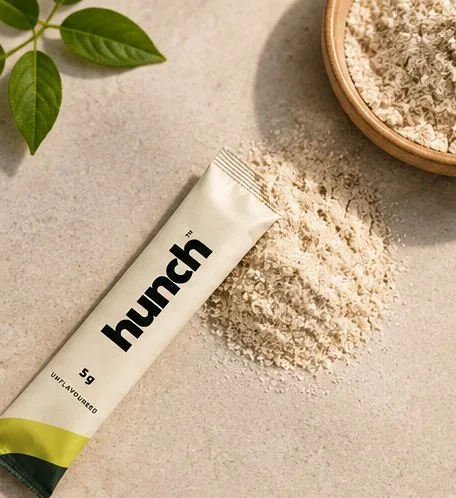 hunch fiber stick pack lying in a pile of psyllium husk powder